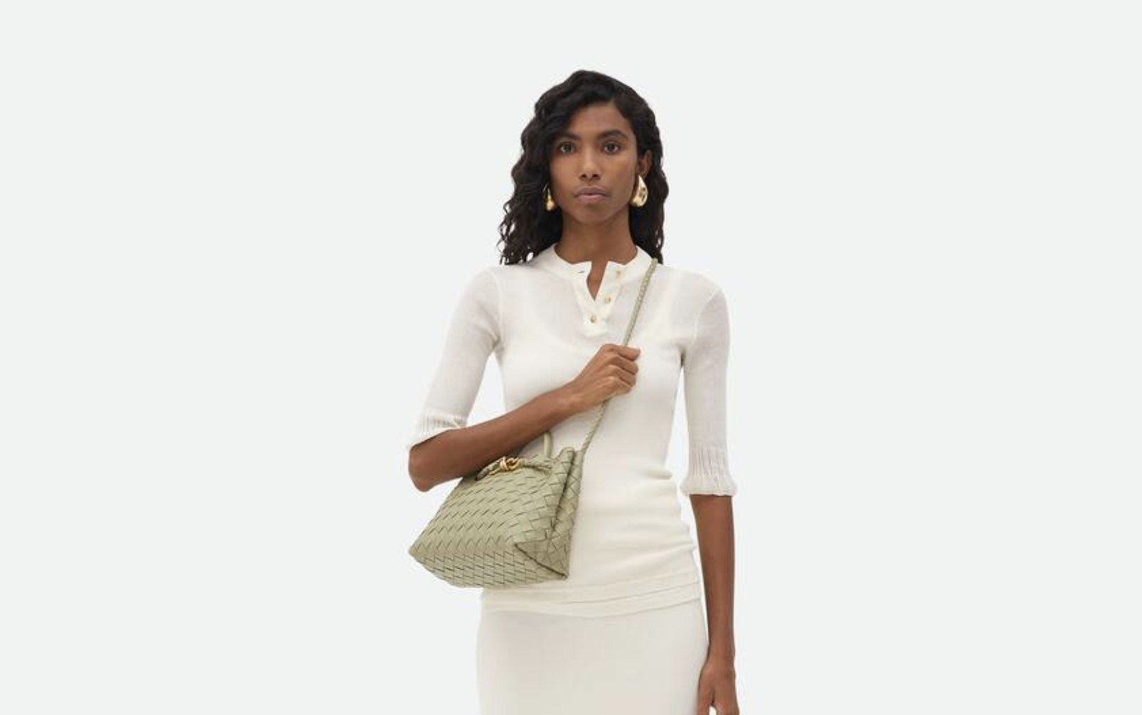 Mini designer handbag resting on a champagne table at a wedding reception Mini designer handbag resting on a champagne table at a wedding reception