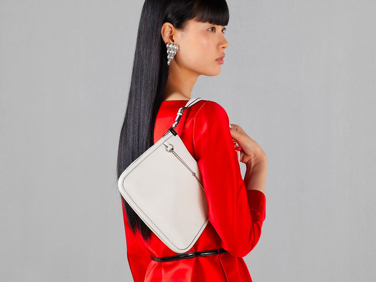 Fashion influencer styling a replica luxury bag with confidence Fashion influencer styling a replica luxury bag with confidence