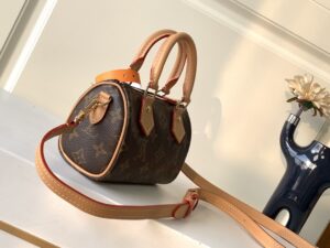Speedy Nano. Authentic quality luxury bag crafted in genuine leather comes with authenticity card, dust bag and gift bag. Iconic Style, Perfectly Miniaturized. Meet the LV Speedy Nano — a petite powerhouse that captures the timeless allure of the iconic Speedy in its most charming form. Revamped in classic Monogram canvas and finished with aged natural cowhide leather, this mini marvel is made for the modern minimalist. Crafted with delicate gold-tone hardware and featuring two signature top handles, the Speedy Nano is both playful and practical. Its removable, adjustable shoulder strap adds effortless versatility—carry it by hand for polished poise or sling it crossbody for chic, on-the-go ease. Compact enough for your essentials. Iconic enough to turn heads. Small bag, big legacy! - CRIS&COCO Speedy Nano. Authentic quality luxury bag crafted in genuine leather comes with authenticity card, dust bag and gift bag. Iconic Style, Perfectly Miniaturized. Meet the LV Speedy Nano — a petite powerhouse that captures the timeless allure of the iconic Speedy in its most charming form. Revamped in classic Monogram canvas and finished with aged natural cowhide leather, this mini marvel is made for the modern minimalist. Crafted with delicate gold-tone hardware and featuring two signature top handles, the Speedy Nano is both playful and practical. Its removable, adjustable shoulder strap adds effortless versatility—carry it by hand for polished poise or sling it crossbody for chic, on-the-go ease. Compact enough for your essentials. Iconic enough to turn heads. Small bag, big legacy!