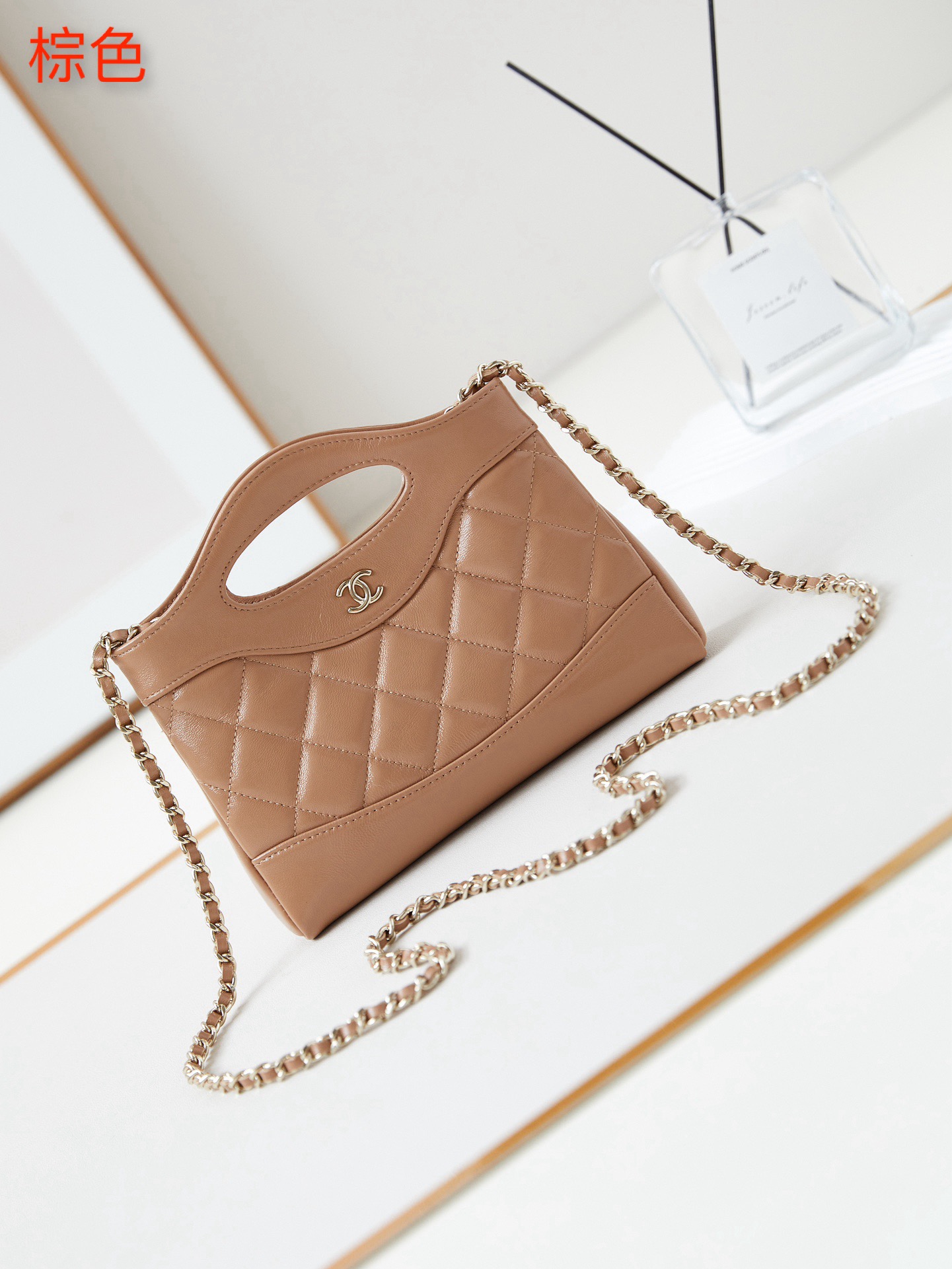 31 Nano Shopping Bag. Authentic quality luxury bag crafted in genuine leather comes with authenticity card, dust bag and gift bag. Small in size, grand in statement.  A miniature marvel that captures the sophistication of *ANEL in its most playful form. Crafted with meticulous precision, this petite icon merges the timeless spirit of the *ANEL 31 with a modern twist on everyday elegance. Designed in supple lambskin and finished with gleaming gold-tone hardware, the Nano 31 doesn’t just carry your essentials — it carries your attitude. Whether worn crossbody, by hand, or dangling from the crook of your arm, this charming piece elevates every ensemble with a whisper of Parisian chic. Perfect for a night out or a day in the spotlight, it’s not just a bag — it’s your boldest accessory in its most compact form. Because luxury doesn't need to shout. Sometimes, it just needs to charm.