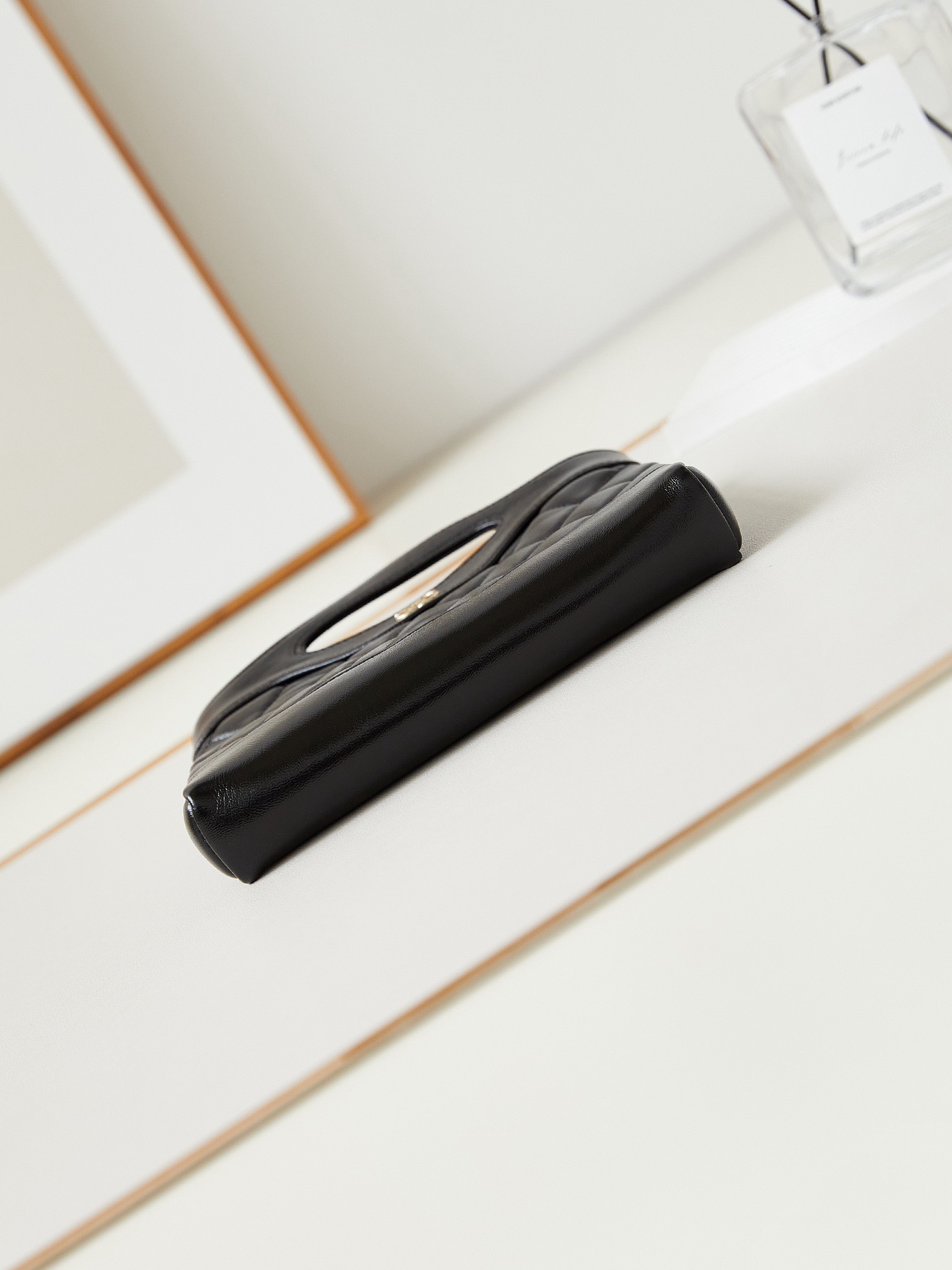 31 Nano Shopping Bag. Authentic quality luxury bag crafted in genuine leather comes with authenticity card, dust bag and gift bag. Small in size, grand in statement.  A miniature marvel that captures the sophistication of *ANEL in its most playful form. Crafted with meticulous precision, this petite icon merges the timeless spirit of the *ANEL 31 with a modern twist on everyday elegance. Designed in supple lambskin and finished with gleaming gold-tone hardware, the Nano 31 doesn’t just carry your essentials — it carries your attitude. Whether worn crossbody, by hand, or dangling from the crook of your arm, this charming piece elevates every ensemble with a whisper of Parisian chic. Perfect for a night out or a day in the spotlight, it’s not just a bag — it’s your boldest accessory in its most compact form. Because luxury doesn't need to shout. Sometimes, it just needs to charm.