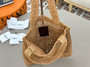 Summer Banana Tote Bag. Authentic quality luxury bag crafted in genuine leather comes with authenticity card, dust bag and gift bag. Heritage in Hand: Where Artisan Craft Meets Summer Elegance. Introducing the Summer Banana Tote—an artisanal masterpiece crafted from raffia and calfskin by a single artisan over 4.5 days in partnership with Made For A Woman. This spacious tote is adorned with a handwritten signature inspired by *loé’s rich heritage, while a playful dangling chain and delicate charms add the perfect finishing touch. A celebration of craftsmanship and effortless summer style. - CRIS&COCO Summer Banana Tote Bag. Authentic quality luxury bag crafted in genuine leather comes with authenticity card, dust bag and gift bag. Heritage in Hand: Where Artisan Craft Meets Summer Elegance. Introducing the Summer Banana Tote—an artisanal masterpiece crafted from raffia and calfskin by a single artisan over 4.5 days in partnership with Made For A Woman. This spacious tote is adorned with a handwritten signature inspired by *loé’s rich heritage, while a playful dangling chain and delicate charms add the perfect finishing touch. A celebration of craftsmanship and effortless summer style.