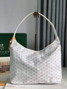 Bohème Hobo Bag. Authentic quality luxury bag crafted in genuine leather comes with authenticity card, dust bag and gift bag. Wander Freely. Carry Elegantly. Introducing the Goyard Bohème Hobo Bag—a tribute to Parisian spirit and wanderlust. Inspired by the timber raftsmen’s humble travel pouches, this bag blends heritage storytelling with everyday luxury. Crafted to be exceptionally lightweight and flexible, it drapes effortlessly on your shoulder with a wide, comfortable handle designed for long city strolls or spontaneous weekend escapes. Its beauty lies not only in its sleek silhouette but also in its thoughtful functionality. The secure zip closure keeps your essentials safe, while the removable snap-fastened pouch doubles as a chic clutch or wallet—perfect for a quick dash or stylish switch-up. Whether you’re wandering through cobblestone streets or navigating your daily routine, the Bohème ensures your essentials are always within reach. This is not just a bag—it’s your elegant partner in carefree adventures.