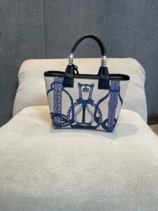 Steeple 25 Bag. Authentic quality luxury bag crafted in genuine leather comes with authenticity card, dust bag and gift bag. Where art meets heritage. The *rmès Steeple Bag is a charming fusion of heritage and artistry, crafted from a blend of canvas and Swift leather. Its design pays tribute to *rmès’ equestrian roots with whip-shaped handles and a stirrup-inspired charm, adding a playful yet sophisticated touch. Lightweight yet spacious, the Steeple is ideal for daily use. Whether you opt for a vibrant motif or a sleek, single-color design, this bag stands out as an artistic expression of luxury that seamlessly integrates into a modern lifestyle. Praised for its unique aesthetic and accessibility within the *rmès lineup, the Steeple Bag is adored by fashion enthusiasts who appreciate its colorful palette and bold personality. While it’s best suited for those who enjoy the texture and look of canvas, it remains a versatile statement piece that captures the spirit of everyday elegance. - CRIS&COCO Steeple 25 Bag. Authentic quality luxury bag crafted in genuine leather comes with authenticity card, dust bag and gift bag. Where art meets heritage. The *rmès Steeple Bag is a charming fusion of heritage and artistry, crafted from a blend of canvas and Swift leather. Its design pays tribute to *rmès’ equestrian roots with whip-shaped handles and a stirrup-inspired charm, adding a playful yet sophisticated touch. Lightweight yet spacious, the Steeple is ideal for daily use. Whether you opt for a vibrant motif or a sleek, single-color design, this bag stands out as an artistic expression of luxury that seamlessly integrates into a modern lifestyle. Praised for its unique aesthetic and accessibility within the *rmès lineup, the Steeple Bag is adored by fashion enthusiasts who appreciate its colorful palette and bold personality. While it’s best suited for those who enjoy the texture and look of canvas, it remains a versatile statement piece that captures the spirit of everyday elegance.