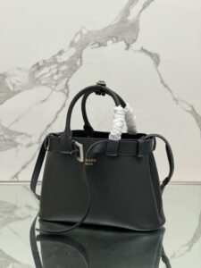 Buckle Small Leather Handbag. Authentic quality luxury bag crafted in genuine leather comes with authenticity card, dust bag and gift bag. Sophistication Meets Utility. Sleek, structured, and undeniably Pr*da — the Buckle Small Leather Handbag captures the brand’s signature balance of minimalist elegance and refined detail. Crafted in smooth leather with a buttery-soft nappa interior, this compact piece is a masterclass in functional luxury. A standout feature? Its interchangeable belt strap, adding a bold, modern twist to the timeless silhouette. Whether you're heading to a meeting or a soirée, this bag adapts seamlessly to your mood and moment. Finished with the embossed iconic logo, it’s a quiet statement of taste and distinction. A versatile companion for the woman who appreciates precision, polish, and just the right touch of edge. - CRIS&COCO Buckle Small Leather Handbag. Authentic quality luxury bag crafted in genuine leather comes with authenticity card, dust bag and gift bag. Sophistication Meets Utility. Sleek, structured, and undeniably Pr*da — the Buckle Small Leather Handbag captures the brand’s signature balance of minimalist elegance and refined detail. Crafted in smooth leather with a buttery-soft nappa interior, this compact piece is a masterclass in functional luxury. A standout feature? Its interchangeable belt strap, adding a bold, modern twist to the timeless silhouette. Whether you're heading to a meeting or a soirée, this bag adapts seamlessly to your mood and moment. Finished with the embossed iconic logo, it’s a quiet statement of taste and distinction. A versatile companion for the woman who appreciates precision, polish, and just the right touch of edge.