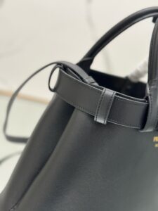 Buckle Small Leather Handbag. Authentic quality luxury bag crafted in genuine leather comes with authenticity card, dust bag and gift bag. Sophistication Meets Utility. Sleek, structured, and undeniably Pr*da — the Buckle Small Leather Handbag captures the brand’s signature balance of minimalist elegance and refined detail. Crafted in smooth leather with a buttery-soft nappa interior, this compact piece is a masterclass in functional luxury. A standout feature? Its interchangeable belt strap, adding a bold, modern twist to the timeless silhouette. Whether you're heading to a meeting or a soirée, this bag adapts seamlessly to your mood and moment. Finished with the embossed iconic logo, it’s a quiet statement of taste and distinction. A versatile companion for the woman who appreciates precision, polish, and just the right touch of edge. - CRIS&COCO Buckle Small Leather Handbag. Authentic quality luxury bag crafted in genuine leather comes with authenticity card, dust bag and gift bag. Sophistication Meets Utility. Sleek, structured, and undeniably Pr*da — the Buckle Small Leather Handbag captures the brand’s signature balance of minimalist elegance and refined detail. Crafted in smooth leather with a buttery-soft nappa interior, this compact piece is a masterclass in functional luxury. A standout feature? Its interchangeable belt strap, adding a bold, modern twist to the timeless silhouette. Whether you're heading to a meeting or a soirée, this bag adapts seamlessly to your mood and moment. Finished with the embossed iconic logo, it’s a quiet statement of taste and distinction. A versatile companion for the woman who appreciates precision, polish, and just the right touch of edge.
