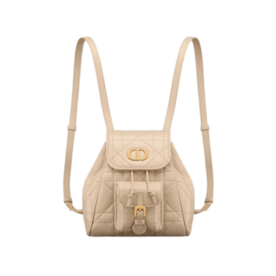 Small Caro Backpack. Authentic quality luxury bag crafted in genuine leather comes with authenticity card, dust bag and gift bag. Elegance Meets Effortless Edge. Elevate your everyday with the Small Caro Backpack — a flawless blend of modern femininity and iconic House craftsmanship. Luxuriously crafted in lambskin, its supple silhouette is enhanced by bold Macrocannage topstitching that whispers timeless *ior style. The antique gold-finish ‘CD’ clasp opens to a drawstring main compartment, perfectly balancing beauty and practicality. A discreet flap pocket keeps your daily essentials close at hand, while the top handle and adjustable leather straps offer versatile, all-day comfort. Whether slung over your shoulder or carried by hand, this petite powerhouse delivers Parisian polish in every step.