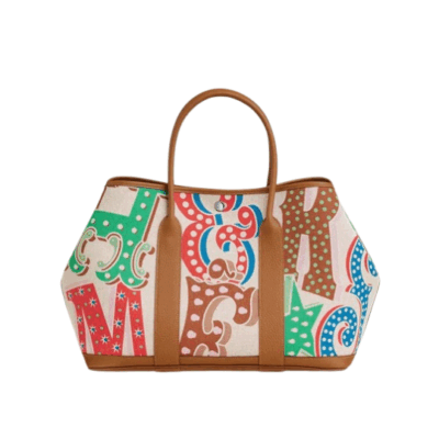 Garden Party Voyage. Authentic quality luxury bag crafted in genuine leather comes with authenticity card, dust bag and gift bag. The Art of Everyday Escape. Chic, structured, and effortlessly refined, the *RMÈS Garden Party Voyage is the perfect companion for your daily adventures or spontaneous weekend getaways. Crafted with precision in supple Negonda leather or canvas with leather trim, this midsize tote strikes the perfect balance between luxury and functionality. Its minimalist silhouette is elevated by discreet Clou de Selle snap closures and expandable sides, offering both form and flexibility. Spacious enough for your essentials yet compact enough to carry with ease, it’s a timeless piece designed to move with you—gracefully. Whether carried in hand or worn over the shoulder, the Garden Party Voyage 36 speaks in whispers of elegance and unmistakable *RMÈS craftsmanship. Every day is a journey. Travel beautifully.