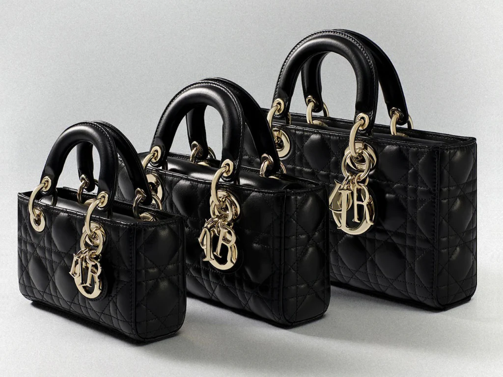 Woman confidently carrying an orange replica BIRKIN bag while walking through New York City Woman confidently carrying an orange replica BIRKIN bag while walking through New York City