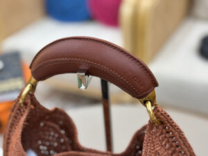 Summer Banana Hobo. Authentic quality luxury bag crafted in genuine leather comes with authenticity card, dust bag and gift bag. Artisanal Spirit, Curved in Style. Say hello to sunshine in bag form. The *LOÉ Summer Banana Hobo Bag is a joyful blend of craftsmanship and creativity, handwoven over four days by a single artisan in collaboration with Made For A Woman. This is not just a bag—it’s a story stitched in raffia and trimmed in luxurious calfskin. Its curved, banana-inspired silhouette hugs the shoulder with ease, while the sculptural handle and handwritten signature nod to *loé’s heritage of effortless elegance. Light, natural, and undeniably chic, it's the perfect companion for sun-soaked escapes or city strolls with a coastal state of mind. A celebration of craftsmanship, femininity, and the art of slow fashion. - CRIS&COCO Summer Banana Hobo. Authentic quality luxury bag crafted in genuine leather comes with authenticity card, dust bag and gift bag. Artisanal Spirit, Curved in Style. Say hello to sunshine in bag form. The *LOÉ Summer Banana Hobo Bag is a joyful blend of craftsmanship and creativity, handwoven over four days by a single artisan in collaboration with Made For A Woman. This is not just a bag—it’s a story stitched in raffia and trimmed in luxurious calfskin. Its curved, banana-inspired silhouette hugs the shoulder with ease, while the sculptural handle and handwritten signature nod to *loé’s heritage of effortless elegance. Light, natural, and undeniably chic, it's the perfect companion for sun-soaked escapes or city strolls with a coastal state of mind. A celebration of craftsmanship, femininity, and the art of slow fashion.
