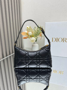 Cigale Mini Bag. Authentic quality luxury bag crafted in genuine leather comes with authenticity card, dust bag and gift bag. A Contemporary Classic in the Making. Meet the latest gem in the Miss Caro line: the *ior Cigale Mini Bag—a sleek, structured piece that blends timeless elegance with modern attitude. Crafted in supple lambskin and elevated by bold Macrocannage topstitching, this petite powerhouse exudes refined femininity from every angle. The standout tonal strap, adorned with an antique gold-finish CD signature, adds a sculptural touch to its streamlined silhouette. A secure zip compartment keeps your essentials close, while the adjustable leather strap offers effortless over-the-shoulder chic. Lightweight, luxurious, and unmistakably *ior—this is the mini bag that delivers big on style. Miss Caro’s modern muse has arrived. - CRIS&COCO Cigale Mini Bag. Authentic quality luxury bag crafted in genuine leather comes with authenticity card, dust bag and gift bag. A Contemporary Classic in the Making. Meet the latest gem in the Miss Caro line: the *ior Cigale Mini Bag—a sleek, structured piece that blends timeless elegance with modern attitude. Crafted in supple lambskin and elevated by bold Macrocannage topstitching, this petite powerhouse exudes refined femininity from every angle. The standout tonal strap, adorned with an antique gold-finish CD signature, adds a sculptural touch to its streamlined silhouette. A secure zip compartment keeps your essentials close, while the adjustable leather strap offers effortless over-the-shoulder chic. Lightweight, luxurious, and unmistakably *ior—this is the mini bag that delivers big on style. Miss Caro’s modern muse has arrived.