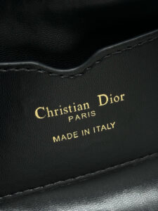 Cigale Mini Bag. Authentic quality luxury bag crafted in genuine leather comes with authenticity card, dust bag and gift bag. A Contemporary Classic in the Making. Meet the latest gem in the Miss Caro line: the *ior Cigale Mini Bag—a sleek, structured piece that blends timeless elegance with modern attitude. Crafted in supple lambskin and elevated by bold Macrocannage topstitching, this petite powerhouse exudes refined femininity from every angle. The standout tonal strap, adorned with an antique gold-finish CD signature, adds a sculptural touch to its streamlined silhouette. A secure zip compartment keeps your essentials close, while the adjustable leather strap offers effortless over-the-shoulder chic. Lightweight, luxurious, and unmistakably *ior—this is the mini bag that delivers big on style. Miss Caro’s modern muse has arrived. - CRIS&COCO Cigale Mini Bag. Authentic quality luxury bag crafted in genuine leather comes with authenticity card, dust bag and gift bag. A Contemporary Classic in the Making. Meet the latest gem in the Miss Caro line: the *ior Cigale Mini Bag—a sleek, structured piece that blends timeless elegance with modern attitude. Crafted in supple lambskin and elevated by bold Macrocannage topstitching, this petite powerhouse exudes refined femininity from every angle. The standout tonal strap, adorned with an antique gold-finish CD signature, adds a sculptural touch to its streamlined silhouette. A secure zip compartment keeps your essentials close, while the adjustable leather strap offers effortless over-the-shoulder chic. Lightweight, luxurious, and unmistakably *ior—this is the mini bag that delivers big on style. Miss Caro’s modern muse has arrived.