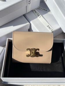 Small Flap Wallet Triomphe. Authentic quality luxury bag crafted in genuine leather comes with authenticity card, dust bag and gift bag. Small in Size, Grand in Style. Discover timeless sophistication in the palm of your hand with the *ELINE Small Flap Wallet TRIOMPHE in shiny calfskin. Meticulously crafted from luxurious leather, this compact beauty showcases the iconic Triomphe clasp in gold-tone metal, a refined nod to Parisian heritage. Despite its petite size, it opens to reveal smart compartments for cards, bills, and coins—proving that style never compromises function. Whether tucked into your favorite designer bag or carried solo for a night out, this wallet is your everyday dose of quiet luxury. - CRIS&COCO Small Flap Wallet Triomphe. Authentic quality luxury bag crafted in genuine leather comes with authenticity card, dust bag and gift bag. Small in Size, Grand in Style. Discover timeless sophistication in the palm of your hand with the *ELINE Small Flap Wallet TRIOMPHE in shiny calfskin. Meticulously crafted from luxurious leather, this compact beauty showcases the iconic Triomphe clasp in gold-tone metal, a refined nod to Parisian heritage. Despite its petite size, it opens to reveal smart compartments for cards, bills, and coins—proving that style never compromises function. Whether tucked into your favorite designer bag or carried solo for a night out, this wallet is your everyday dose of quiet luxury.