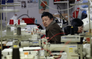 Hands that stitch luxury in silence. The unseen labor behind the label.