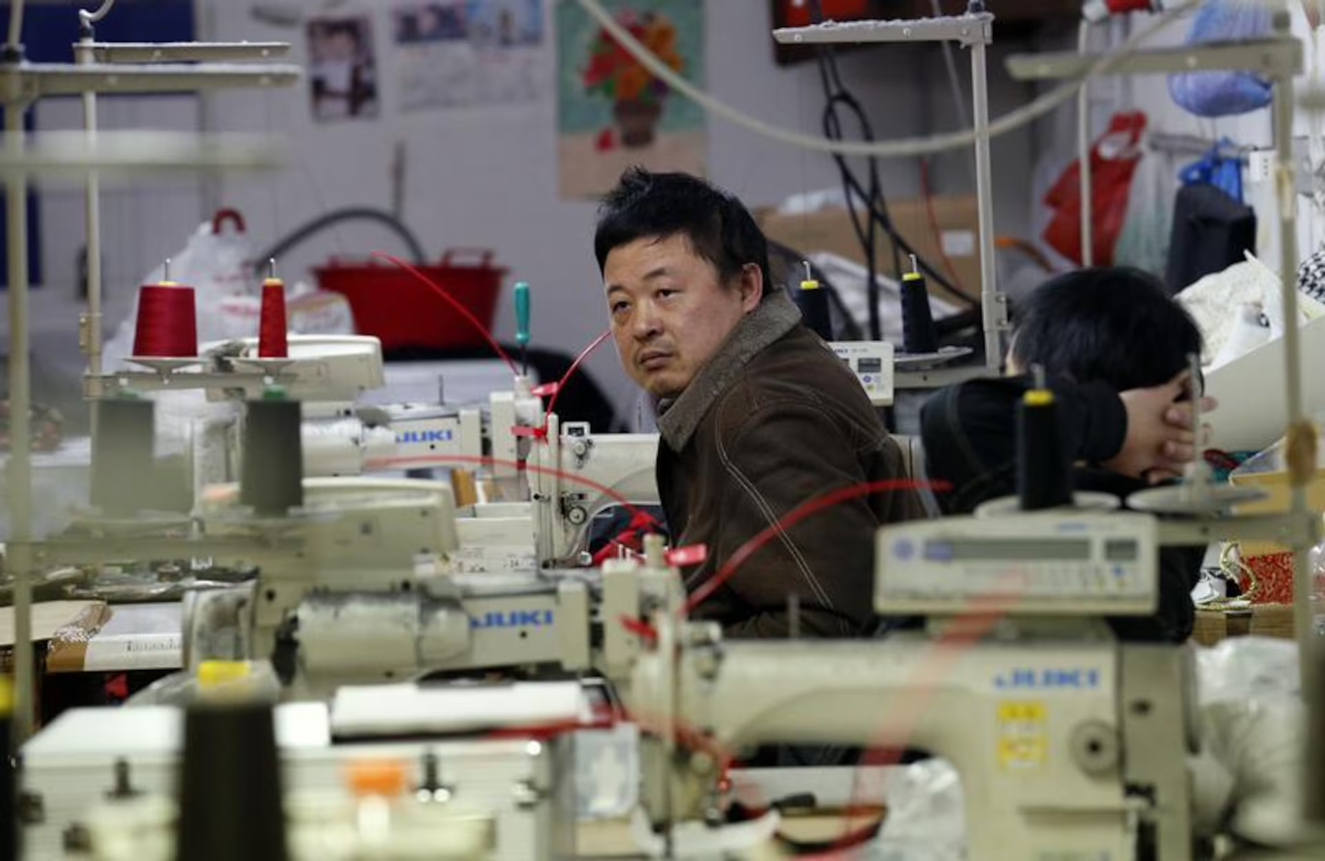 Hands that stitch luxury in silence. The unseen labor behind the label. Hands that stitch luxury in silence. The unseen labor behind the label.