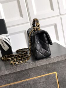 Mini Handy CC Flap Bag. Authentic quality luxury bag crafted in genuine leather comes with authenticity card, dust bag and gift bag. Petite yet powerful, the Caviar Quilted Mini Handy CC Flap embodies timeless sophistication. Crafted from signature caviar leather with classic diamond quilting, this bag exudes refined elegance in every stitch. The design features a structured top handle and a leather-threaded chain strap, offering versatile styling from hand-carry to crossbody. Gold-plated CC details and the signature turn-lock closure add the perfect touch of luxury. Inside, a sleek leather interior with both zipper and patch pockets ensures your essentials stay beautifully organized. Compact, iconic, and unmistakably *ANEL — this is the ultimate statement in modern classic style.
