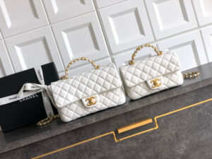 Mini Handy CC Flap Bag. Authentic quality luxury bag crafted in genuine leather comes with authenticity card, dust bag and gift bag. Petite yet powerful, the Caviar Quilted Mini Handy CC Flap embodies timeless sophistication. Crafted from signature caviar leather with classic diamond quilting, this bag exudes refined elegance in every stitch. The design features a structured top handle and a leather-threaded chain strap, offering versatile styling from hand-carry to crossbody. Gold-plated CC details and the signature turn-lock closure add the perfect touch of luxury. Inside, a sleek leather interior with both zipper and patch pockets ensures your essentials stay beautifully organized. Compact, iconic, and unmistakably *ANEL — this is the ultimate statement in modern classic style.