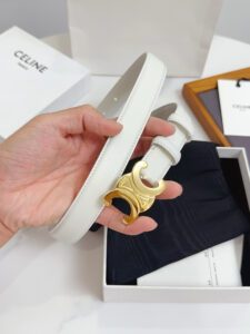 Border Triomphe Belt. Authentic quality luxury bag crafted in genuine leather comes with authenticity card, dust bag and gift bag. Where Parisian Precision Meets Effortless Elegance. The Border Triomphe Belt embodies Parisian refinement in its purest form. Crafted from luxurious smooth calfskin, this elegant accessory is framed by subtle contrasting borders that highlight its sleek lines and meticulous craftsmanship. At its center, the iconic Triomphe buckle—an emblem of *ELINE’s timeless heritage—adds a touch of golden sophistication. Whether paired with tailored trousers, a flowing dress, or high-waisted denim, this belt transforms any outfit into a statement of effortless elegance. A true symbol of quiet luxury, the Border Triomphe Belt is the ultimate finishing touch for those who appreciate understated glamour and modern French allure.