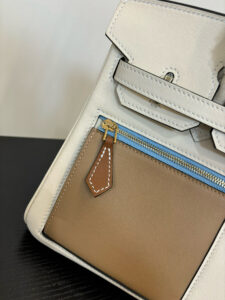 Swift Colormatic Uni Birkin. Authentic quality luxury bag crafted in genuine leather comes with authenticity card, dust bag and gift bag. Where Color Meets Craft — The Art of Birkin Reimagined. The Swift Colormatic Uni Birkin is a rare masterpiece of craftsmanship and color harmony. Expertly crafted from luxuriously soft Swift leather, this special-order Birkin reimagines classic sophistication with a playful, modern twist. Its thoughtful design includes a front zipper pocket, rear flat pocket, and the iconic short crossover flap secured by a signature turn-lock closure. Inside, a supple leather interior with both zipper and patch pockets ensures your essentials are beautifully organized. From its smooth texture to its meticulous detailing, the Swift Colormatic Uni Birkin is more than a handbag — it’s an exclusive statement of individuality and timeless Hermès artistry.