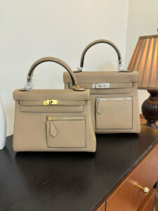 Kelly Colormatic. Authentic quality luxury bag crafted in genuine leather comes with authenticity card, dust bag and gift bag. Hand-crafted from ultra-smooth Swift leather and finished with radiant gold hardware, this exceptional limited-edition masterpiece brings a fresh, artistic twist to the iconic Kelly silhouette. Its cleverly designed front pocket opens wide with a single gusset for effortless access, while the rear flap pocket keeps your daily essentials—especially your most-used cards—right at your fingertips. The asymmetric yet perfectly balanced colour combination highlights the haute craftsmanship Hermès is celebrated for, turning every stitch into a statement. A collector’s dream and a style enthusiast’s delight, the Kelly Colormatic is sophistication with a spark—functional, vibrant, and unmistakably *rmès.