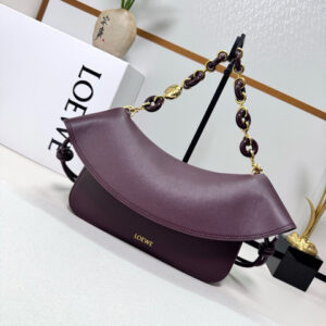 Medium Ola Bag. Authentic quality luxury bag crafted in genuine leather comes with authenticity card, dust bag and gift bag. Soft Curves, Bold Style. Introducing the *OEWE Ola Bag — Where Fluid Design Meets Effortless Luxury. This Ola bag is your new summer essential: soft, lightweight, and irresistibly modern. Defined by its beautifully curved silhouette, flowing flap, and iconic donut chain detail, this piece blends sculptural elegance with everyday practicality. Crafted in smooth, premium calfskin, the medium Ola offers a refined touch while remaining exceptionally versatile. Whether worn for daytime ease or evening polish, it elevates any look with its understated yet striking aesthetic. A statement of craftsmanship. A celebration of movement. A summer icon in the making.