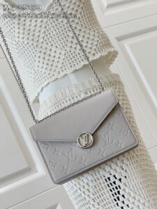 Wallet On Chain Rosy. Authentic quality luxury bag crafted in genuine leather comes with authenticity card, dust bag and gift bag. Rosy Elegance, Effortlessly Carried. Introducing the Wallet On Chain Rosy—a compact statement of modern elegance. Crafted from the House’s signature Monogram Empreinte leather, this chic piece brings timeless sophistication to any outfit. The design shines with a gold-toned LV Circle and a sleek chain strap, offering effortless shoulder carry for day or night. Despite its refined silhouette, the Rosy is smartly sized to hold your everyday must-haves, complete with three secure card slots to keep essentials organized. A perfect blend of luxury, versatility, and iconic craftsmanship—your new go-to accessory for every occasion.