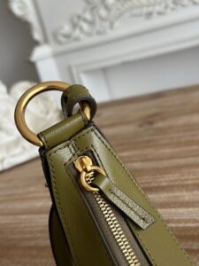 Banana Cross-Body Bag.  Authentic quality luxury bag crafted in genuine leather comes with authenticity card, dust bag and gift bag. Playful Design, Iconic Craftsmanship Meet your new style statement: the *LOÉ Banana, a charming cross-body bag crafted from luxurious shiny grained calfskin. Inspired by *loé’s legendary Spring 2001 collection, its sculptural, banana-shaped silhouette highlights the Maison’s signature artistry with a refined 3D textured effect. Perfectly sized to hold your phone, cardholder, and daily essentials, this lighthearted yet sophisticated accessory blends practicality with Parisian elegance. An adjustable strap allows effortless shoulder or crossbody wear, making it your go-anywhere companion.