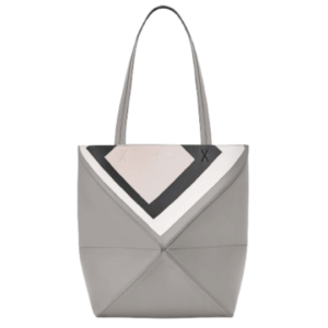 Medium Puzzle Fold Tote.  Authentic quality luxury bag crafted in genuine leather comes with authenticity card, dust bag and gift bag. Modern art meets effortless luxury. This exceptional piece reimagines the iconic Puzzle Fold silhouette with a lightweight geometric structure that folds completely flat, making it the ultimate travel companion. Crafted in supple nappa calfskin, the tote features exquisite leather marquetry squares inspired by Josef Albers’s celebrated Homage to the Square series. Each panel reflects precision, balance, and *OEWE’s unmatched craftsmanship, transforming a functional tote into a wearable work of art. Part of the exclusive *OEWE x Albers collection, this medium Puzzle Fold tote blends practicality with cultural sophistication, offering spacious elegance for everyday moments, weekend escapes, and artful adventures. A collectible masterpiece—crafted for the modern collector.