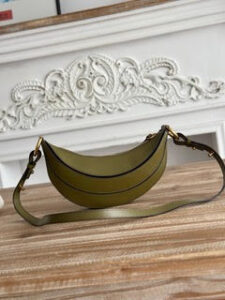 Banana Cross-Body Bag. Authentic quality luxury bag crafted in genuine leather comes with authenticity card, dust bag and gift bag. Playful Design, Iconic Craftsmanship Meet your new style statement: the *LOÉ Banana, a charming cross-body bag crafted from luxurious shiny grained calfskin. Inspired by *loé’s legendary Spring 2001 collection, its sculptural, banana-shaped silhouette highlights the Maison’s signature artistry with a refined 3D textured effect. Perfectly sized to hold your phone, cardholder, and daily essentials, this lighthearted yet sophisticated accessory blends practicality with Parisian elegance. An adjustable strap allows effortless shoulder or crossbody wear, making it your go-anywhere companion. - CRIS&COCO Banana Cross-Body Bag. Authentic quality luxury bag crafted in genuine leather comes with authenticity card, dust bag and gift bag. Playful Design, Iconic Craftsmanship Meet your new style statement: the *LOÉ Banana, a charming cross-body bag crafted from luxurious shiny grained calfskin. Inspired by *loé’s legendary Spring 2001 collection, its sculptural, banana-shaped silhouette highlights the Maison’s signature artistry with a refined 3D textured effect. Perfectly sized to hold your phone, cardholder, and daily essentials, this lighthearted yet sophisticated accessory blends practicality with Parisian elegance. An adjustable strap allows effortless shoulder or crossbody wear, making it your go-anywhere companion.