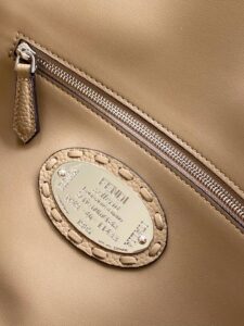 Baguette Medium. Authentic quality luxury bag crafted in genuine leather comes with authenticity card, dust bag and gift bag. A Legacy in Every Stitch. An icon, reimagined with artisanal mastery—the *ENDI Medium Baguette is a tribute to heritage and timeless design. Crafted in rich cappuccino Cuoio Romano leather, this piece features 612 hand-sewn tone-on-tone macro topstitches, showcasing the legendary Selleria craftsmanship passed down since 1925. Its structured silhouette is elevated by the signature FF clasp, while the soft calfskin interior, complete with a zip pocket, keeps essentials elegantly organized. Finished with a silver Selleria plaque and palladium-finish hardware, every detail speaks of quiet luxury. Versatility meets sophistication with a detachable handle and shoulder strap, allowing it to be carried by hand, worn on the shoulder, or styled cross-body. A true icon—crafted by hand, designed to last a lifetime. - CRIS&COCO Baguette Medium. Authentic quality luxury bag crafted in genuine leather comes with authenticity card, dust bag and gift bag. A Legacy in Every Stitch. An icon, reimagined with artisanal mastery—the *ENDI Medium Baguette is a tribute to heritage and timeless design. Crafted in rich cappuccino Cuoio Romano leather, this piece features 612 hand-sewn tone-on-tone macro topstitches, showcasing the legendary Selleria craftsmanship passed down since 1925. Its structured silhouette is elevated by the signature FF clasp, while the soft calfskin interior, complete with a zip pocket, keeps essentials elegantly organized. Finished with a silver Selleria plaque and palladium-finish hardware, every detail speaks of quiet luxury. Versatility meets sophistication with a detachable handle and shoulder strap, allowing it to be carried by hand, worn on the shoulder, or styled cross-body. A true icon—crafted by hand, designed to last a lifetime.
