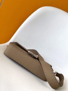 Baguette Medium.  Authentic quality luxury bag crafted in genuine leather comes with authenticity card, dust bag and gift bag. A Legacy in Every Stitch. An icon, reimagined with artisanal mastery—the *ENDI Medium Baguette is a tribute to heritage and timeless design. Crafted in rich cappuccino Cuoio Romano leather, this piece features 612 hand-sewn tone-on-tone macro topstitches, showcasing the legendary Selleria craftsmanship passed down since 1925. Its structured silhouette is elevated by the signature FF clasp, while the soft calfskin interior, complete with a zip pocket, keeps essentials elegantly organized. Finished with a silver Selleria plaque and palladium-finish hardware, every detail speaks of quiet luxury. Versatility meets sophistication with a detachable handle and shoulder strap, allowing it to be carried by hand, worn on the shoulder, or styled cross-body. A true icon—crafted by hand, designed to last a lifetime.