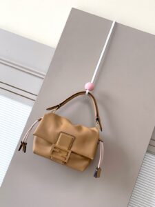 Small Mamma Baguette. Authentic quality luxury bag crafted in genuine leather comes with authenticity card, dust bag and gift bag. A Soft Revival of an Icon. Born in the late ’90s as the effortlessly chic “big sister” to the original, the Mamma Baguette returns for Spring/Summer 2025 with a modern, deconstructed allure. Reimagined in dreamy nappa leather, it blends nostalgia with a fresh, fluid silhouette that feels both relaxed and refined. An oversized FF clasp, accented with a tonal leather insert, anchors the design with signature *ENDI attitude. Inside, a generously sized suede-lined compartment with a drawstring closure and ties offers both luxury and practicality. Finished with gold-tone hardware and complete with detachable handle and shoulder strap, it transitions seamlessly from hand-held elegance to crossbody ease. Soft, iconic, and undeniably modern—the Mamma Baguette is back, and better than ever. - CRIS&COCO Small Mamma Baguette. Authentic quality luxury bag crafted in genuine leather comes with authenticity card, dust bag and gift bag. A Soft Revival of an Icon. Born in the late ’90s as the effortlessly chic “big sister” to the original, the Mamma Baguette returns for Spring/Summer 2025 with a modern, deconstructed allure. Reimagined in dreamy nappa leather, it blends nostalgia with a fresh, fluid silhouette that feels both relaxed and refined. An oversized FF clasp, accented with a tonal leather insert, anchors the design with signature *ENDI attitude. Inside, a generously sized suede-lined compartment with a drawstring closure and ties offers both luxury and practicality. Finished with gold-tone hardware and complete with detachable handle and shoulder strap, it transitions seamlessly from hand-held elegance to crossbody ease. Soft, iconic, and undeniably modern—the Mamma Baguette is back, and better than ever.