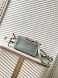 Small Mamma Baguette. Authentic quality luxury bag crafted in genuine leather comes with authenticity card, dust bag and gift bag. A Soft Revival of an Icon. Born in the late ’90s as the effortlessly chic “big sister” to the original, the Mamma Baguette returns for Spring/Summer 2025 with a modern, deconstructed allure. Reimagined in dreamy nappa leather, it blends nostalgia with a fresh, fluid silhouette that feels both relaxed and refined. An oversized FF clasp, accented with a tonal leather insert, anchors the design with signature *ENDI attitude. Inside, a generously sized suede-lined compartment with a drawstring closure and ties offers both luxury and practicality. Finished with gold-tone hardware and complete with detachable handle and shoulder strap, it transitions seamlessly from hand-held elegance to crossbody ease. Soft, iconic, and undeniably modern—the Mamma Baguette is back, and better than ever. - CRIS&COCO Small Mamma Baguette. Authentic quality luxury bag crafted in genuine leather comes with authenticity card, dust bag and gift bag. A Soft Revival of an Icon. Born in the late ’90s as the effortlessly chic “big sister” to the original, the Mamma Baguette returns for Spring/Summer 2025 with a modern, deconstructed allure. Reimagined in dreamy nappa leather, it blends nostalgia with a fresh, fluid silhouette that feels both relaxed and refined. An oversized FF clasp, accented with a tonal leather insert, anchors the design with signature *ENDI attitude. Inside, a generously sized suede-lined compartment with a drawstring closure and ties offers both luxury and practicality. Finished with gold-tone hardware and complete with detachable handle and shoulder strap, it transitions seamlessly from hand-held elegance to crossbody ease. Soft, iconic, and undeniably modern—the Mamma Baguette is back, and better than ever.