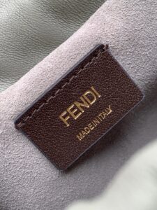 Small Mamma Baguette. Authentic quality luxury bag crafted in genuine leather comes with authenticity card, dust bag and gift bag. A Soft Revival of an Icon. Born in the late ’90s as the effortlessly chic “big sister” to the original, the Mamma Baguette returns for Spring/Summer 2025 with a modern, deconstructed allure. Reimagined in dreamy nappa leather, it blends nostalgia with a fresh, fluid silhouette that feels both relaxed and refined. An oversized FF clasp, accented with a tonal leather insert, anchors the design with signature *ENDI attitude. Inside, a generously sized suede-lined compartment with a drawstring closure and ties offers both luxury and practicality. Finished with gold-tone hardware and complete with detachable handle and shoulder strap, it transitions seamlessly from hand-held elegance to crossbody ease. Soft, iconic, and undeniably modern—the Mamma Baguette is back, and better than ever.