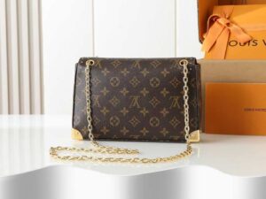Trunkie. Authentic quality luxury bag crafted in genuine leather comes with authenticity card, dust bag and gift bag. Heritage, Reimagined for Today. A bold tribute to the House’s storied past, the Trunkie brings the spirit of vintage travel into a sleek, modern silhouette. Crafted in iconic Monogram canvas and adorned with 38 gold-toned rivets, it echoes the timeless charm of classic LV trunks. Metallic corners and the signature S-lock closure elevate its structured design, while the sliding chain offers versatile styling—from shoulder to crossbody with effortless ease. Inside, a thoughtfully sized interior with a zipped pocket keeps your essentials perfectly organized. Where history meets modern sophistication, the Trunkie is more than a bag—it’s a statement of enduring luxury.