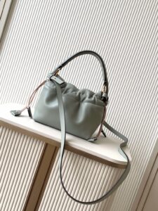 Small Mamma Baguette. Authentic quality luxury bag crafted in genuine leather comes with authenticity card, dust bag and gift bag. A Soft Revival of an Icon. Born in the late ’90s as the effortlessly chic “big sister” to the original, the Mamma Baguette returns for Spring/Summer 2025 with a modern, deconstructed allure. Reimagined in dreamy nappa leather, it blends nostalgia with a fresh, fluid silhouette that feels both relaxed and refined. An oversized FF clasp, accented with a tonal leather insert, anchors the design with signature *ENDI attitude. Inside, a generously sized suede-lined compartment with a drawstring closure and ties offers both luxury and practicality. Finished with gold-tone hardware and complete with detachable handle and shoulder strap, it transitions seamlessly from hand-held elegance to crossbody ease. Soft, iconic, and undeniably modern—the Mamma Baguette is back, and better than ever. - CRIS&COCO Small Mamma Baguette. Authentic quality luxury bag crafted in genuine leather comes with authenticity card, dust bag and gift bag. A Soft Revival of an Icon. Born in the late ’90s as the effortlessly chic “big sister” to the original, the Mamma Baguette returns for Spring/Summer 2025 with a modern, deconstructed allure. Reimagined in dreamy nappa leather, it blends nostalgia with a fresh, fluid silhouette that feels both relaxed and refined. An oversized FF clasp, accented with a tonal leather insert, anchors the design with signature *ENDI attitude. Inside, a generously sized suede-lined compartment with a drawstring closure and ties offers both luxury and practicality. Finished with gold-tone hardware and complete with detachable handle and shoulder strap, it transitions seamlessly from hand-held elegance to crossbody ease. Soft, iconic, and undeniably modern—the Mamma Baguette is back, and better than ever.