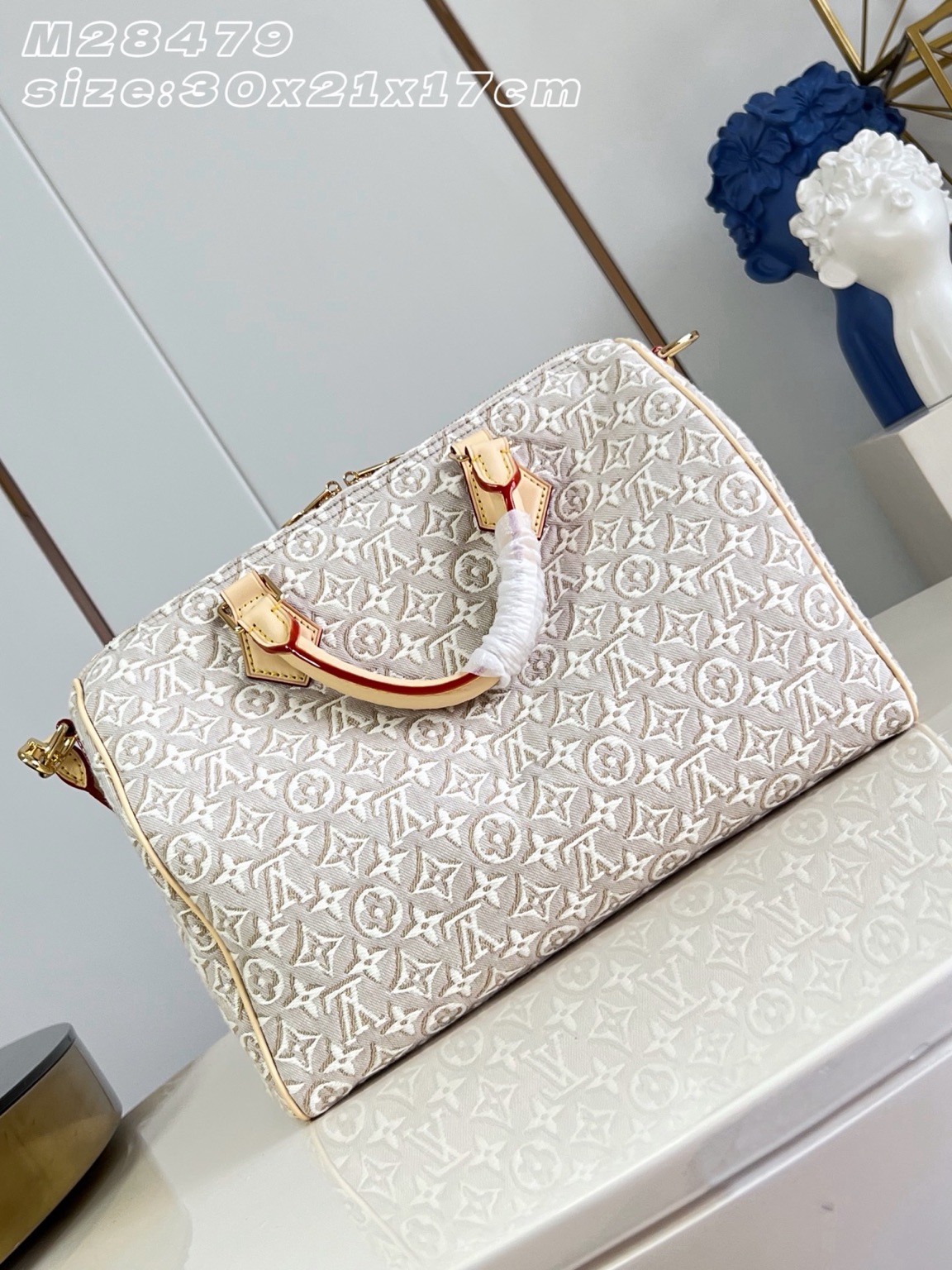 Speedy Soft 30 3 Speedy Soft 30. Authentic quality luxury bag crafted in genuine leather comes with authenticity card, dust bag and gift bag. A Modern Icon, Beautifully Reimagined. The Speedy Soft 30 redefines an iconic silhouette with a fresh expression of the House's legendary craftsmanship. Showcasing the new Monogram Emblème signature, the jacquard canvas is expertly woven to create an elegant, embroidery-inspired finish that blends heritage with innovation. Presented in the sophisticated Peuplier colorway, this edition is accented with a contrasting leather strap, beautifully braided handles, and an exclusive LV address tag for a distinctive finishing touch. Spacious enough to carry your daily essentials—including a tablet—the Speedy Soft 30 offers effortless functionality without compromising on style. Designed for modern lifestyles, this timeless handbag seamlessly combines luxury, versatility, and contemporary elegance, making it the perfect companion from workdays to weekend escapes.