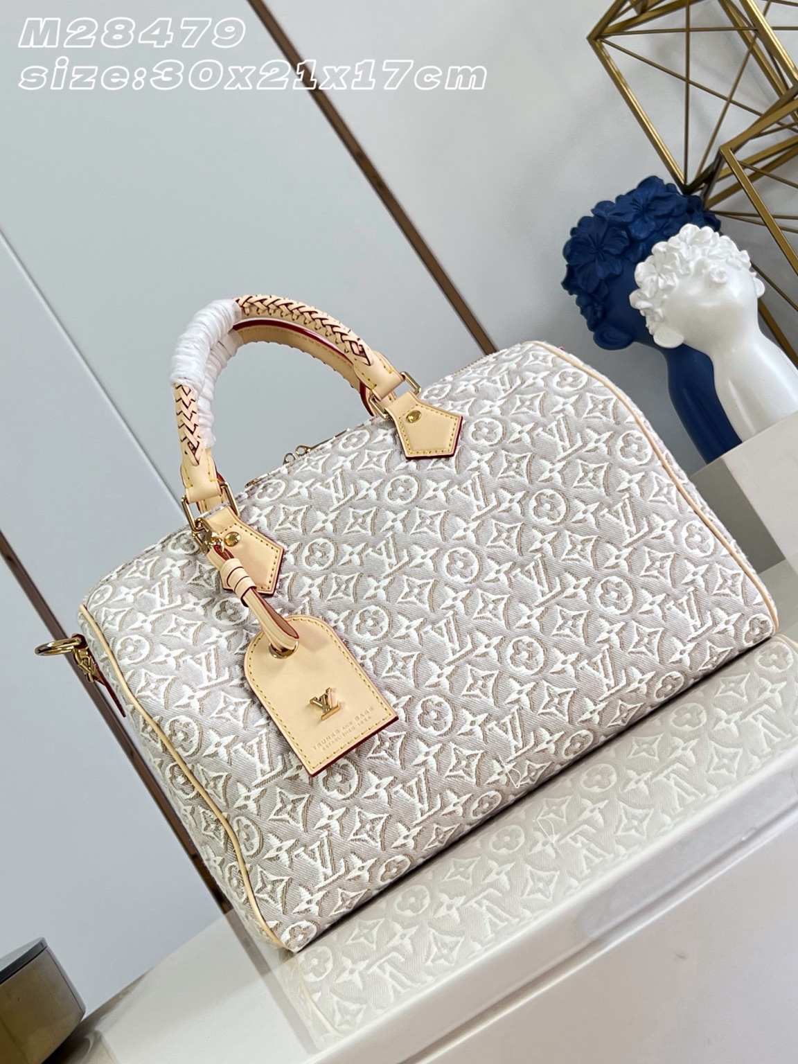 Speedy Soft 30 2 Speedy Soft 30. Authentic quality luxury bag crafted in genuine leather comes with authenticity card, dust bag and gift bag. A Modern Icon, Beautifully Reimagined. The Speedy Soft 30 redefines an iconic silhouette with a fresh expression of the House's legendary craftsmanship. Showcasing the new Monogram Emblème signature, the jacquard canvas is expertly woven to create an elegant, embroidery-inspired finish that blends heritage with innovation. Presented in the sophisticated Peuplier colorway, this edition is accented with a contrasting leather strap, beautifully braided handles, and an exclusive LV address tag for a distinctive finishing touch. Spacious enough to carry your daily essentials—including a tablet—the Speedy Soft 30 offers effortless functionality without compromising on style. Designed for modern lifestyles, this timeless handbag seamlessly combines luxury, versatility, and contemporary elegance, making it the perfect companion from workdays to weekend escapes.