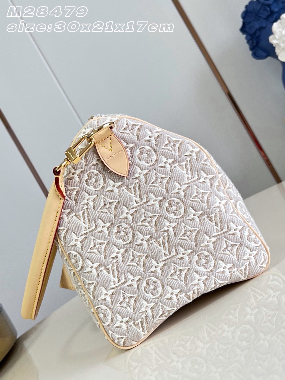Speedy Soft 30 7 Speedy Soft 30. Authentic quality luxury bag crafted in genuine leather comes with authenticity card, dust bag and gift bag. A Modern Icon, Beautifully Reimagined. The Speedy Soft 30 redefines an iconic silhouette with a fresh expression of the House's legendary craftsmanship. Showcasing the new Monogram Emblème signature, the jacquard canvas is expertly woven to create an elegant, embroidery-inspired finish that blends heritage with innovation. Presented in the sophisticated Peuplier colorway, this edition is accented with a contrasting leather strap, beautifully braided handles, and an exclusive LV address tag for a distinctive finishing touch. Spacious enough to carry your daily essentials—including a tablet—the Speedy Soft 30 offers effortless functionality without compromising on style. Designed for modern lifestyles, this timeless handbag seamlessly combines luxury, versatility, and contemporary elegance, making it the perfect companion from workdays to weekend escapes.