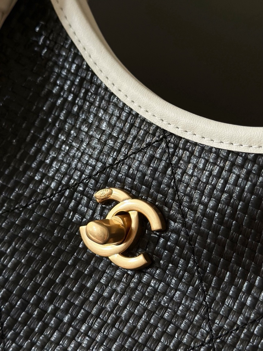 Raffia Braided Small Shopping Tote 3 Raffia Braided Small Shopping Tote. Authentic quality luxury bag crafted in genuine leather comes with authenticity card, dust bag and gift bag. Effortless Summer Sophistication. The *ANEL Small Tote brings a fresh, summery spirit to timeless *ANEL elegance. Crafted from beautifully braided raffia and refined calfskin, its sophisticated black-and-white palette creates an effortlessly chic look. Natural raffia texture adds relaxed seasonal charm, while smooth calfskin details bring structure and a luxurious finish. Luminous gold-tone hardware completes the design with a subtle touch of glamour. Light, versatile, and undeniably elegant, this tote is made for everyday moments when effortless style matters. A modern summer classic with unmistakable *ANEL allure.