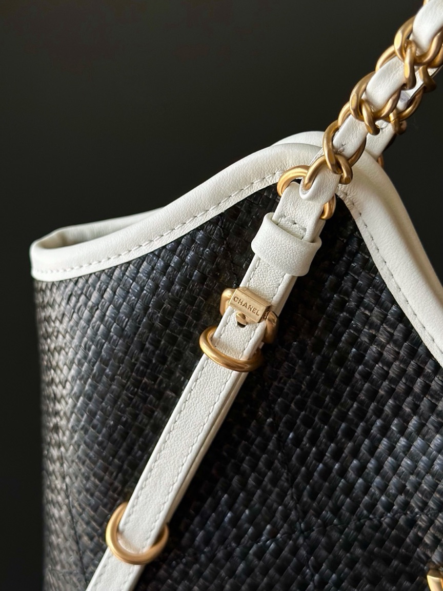 Raffia Braided Small Shopping Tote 4 Raffia Braided Small Shopping Tote. Authentic quality luxury bag crafted in genuine leather comes with authenticity card, dust bag and gift bag. Effortless Summer Sophistication. The *ANEL Small Tote brings a fresh, summery spirit to timeless *ANEL elegance. Crafted from beautifully braided raffia and refined calfskin, its sophisticated black-and-white palette creates an effortlessly chic look. Natural raffia texture adds relaxed seasonal charm, while smooth calfskin details bring structure and a luxurious finish. Luminous gold-tone hardware completes the design with a subtle touch of glamour. Light, versatile, and undeniably elegant, this tote is made for everyday moments when effortless style matters. A modern summer classic with unmistakable *ANEL allure.