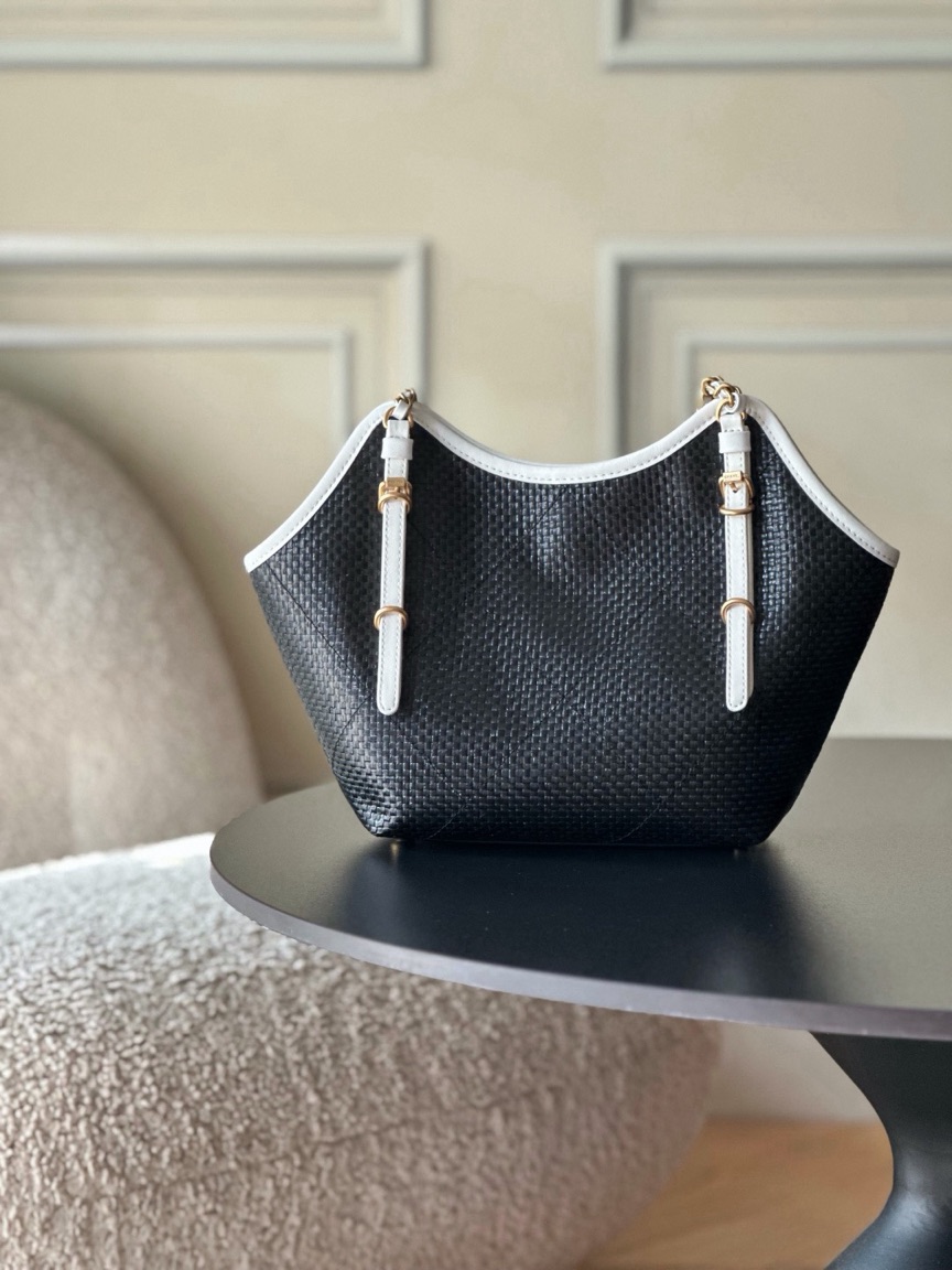 Raffia Braided Small Shopping Tote 5 Raffia Braided Small Shopping Tote. Authentic quality luxury bag crafted in genuine leather comes with authenticity card, dust bag and gift bag. Effortless Summer Sophistication. The *ANEL Small Tote brings a fresh, summery spirit to timeless *ANEL elegance. Crafted from beautifully braided raffia and refined calfskin, its sophisticated black-and-white palette creates an effortlessly chic look. Natural raffia texture adds relaxed seasonal charm, while smooth calfskin details bring structure and a luxurious finish. Luminous gold-tone hardware completes the design with a subtle touch of glamour. Light, versatile, and undeniably elegant, this tote is made for everyday moments when effortless style matters. A modern summer classic with unmistakable *ANEL allure.