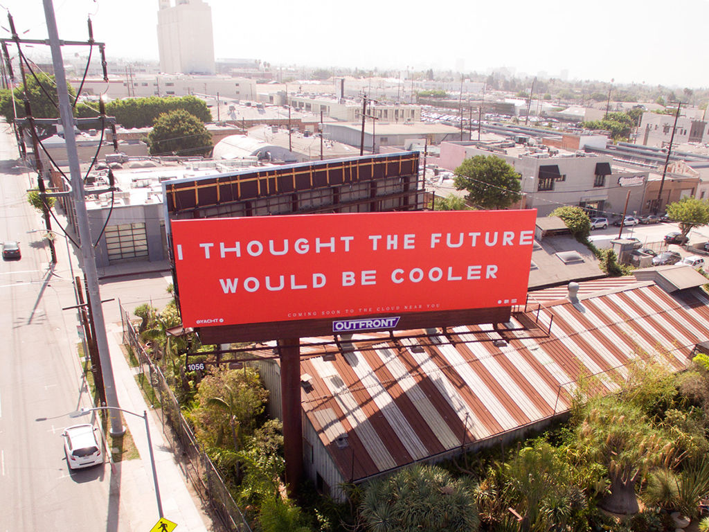 A witty urban billboard reads “I thought the future would be cooler,” capturing the gap between our futuristic expectations and everyday modern reality.